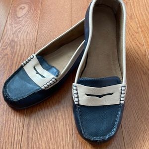 Penny loafer.  Leather upper with rubber soles.